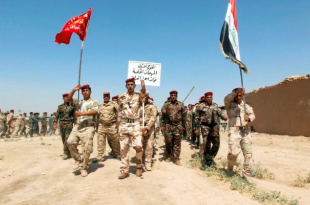 Popular Mobilisation Forces (PMF) march during a military parade in Daquq, nearby Kirkuk, Iraq August 5, 2017. REUTERS/Ako Rasheed