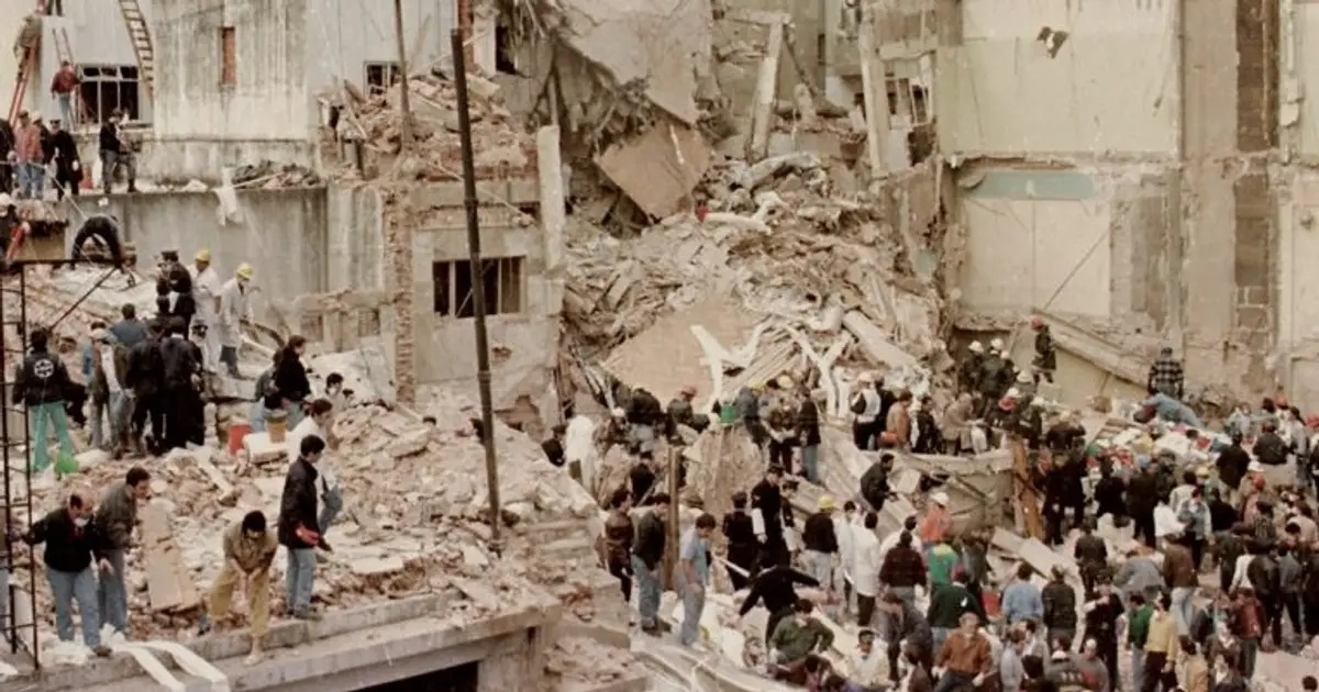 Rescue workers search the remains of the AMIA headquarters in Buenos Aires, Argentina, in 1994.