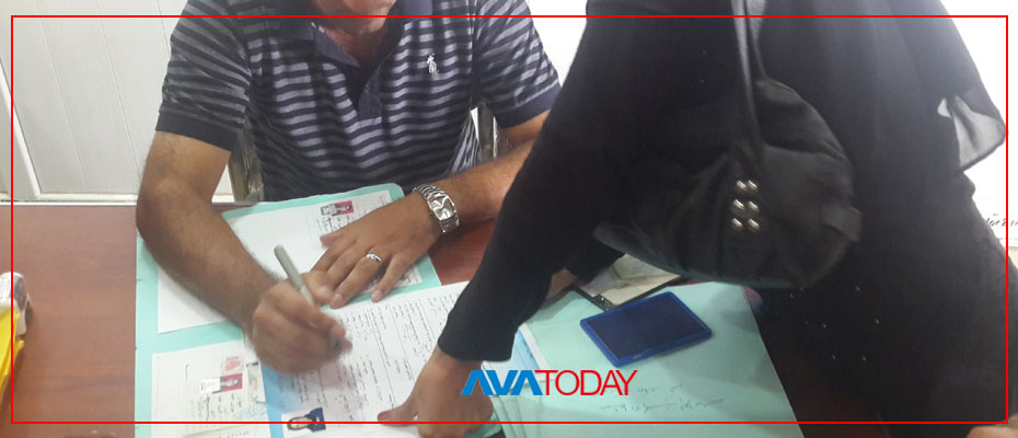 Ezidi survivor being fingerprinted for her jensia