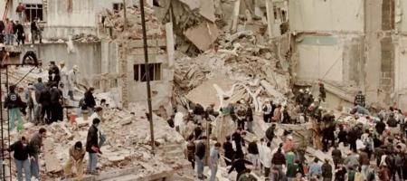 Rescue workers search the remains of the AMIA headquarters in Buenos Aires, Argentina, in 1994.