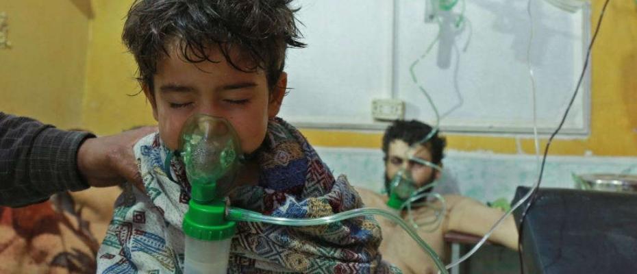 Syrian children and adults receive treatment for a suspected chemical attack at a makeshift clinic in the eastern Ghouta region on the outskirts of Damascus on February 25.